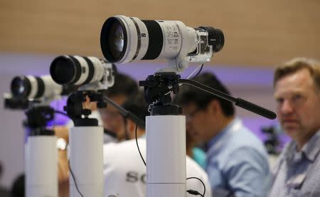 Sony camera lenses with attached lens-like cameras ILCE-QX1 with 20.1MP sensors are pictured at the IFA consumer technology fair in Berlin, in this September 5, 2014 file photo. REUTERS/Fabrizio Bensch/Files
