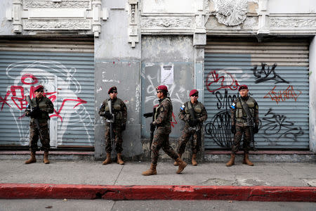 Soldiers are seen near the Congress during a protest to demand the resignation of Guatemala's President Jimmy Morales in Guatemala City, Guatemala September 12, 2018. REUTERS/Luis Echeverria