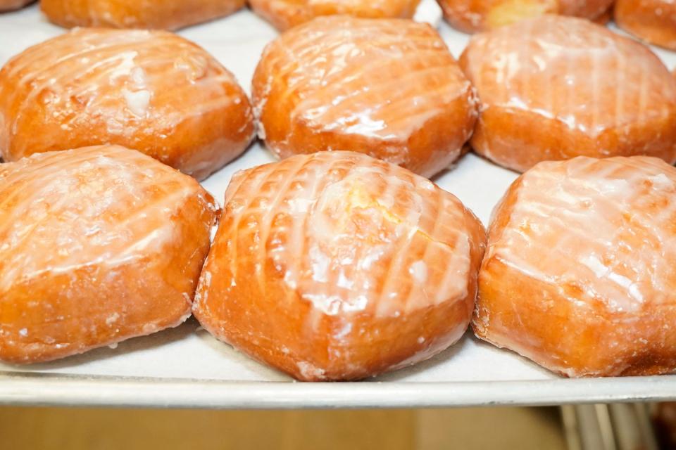 Some finished paczki, glazed with crème filling, at Morning Fresh Bakeries in Adrian are ready to be enjoyed in celebration of Fat Tuesday, also known as Paczki Day, which is today.