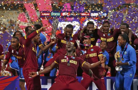 Cricket - England v West Indies - World Twenty20 cricket tournament final - Kolkata, India - 03/04/2016. West Indies players celebrate with the trophy after winning the final. REUTERS/Adnan Abidi