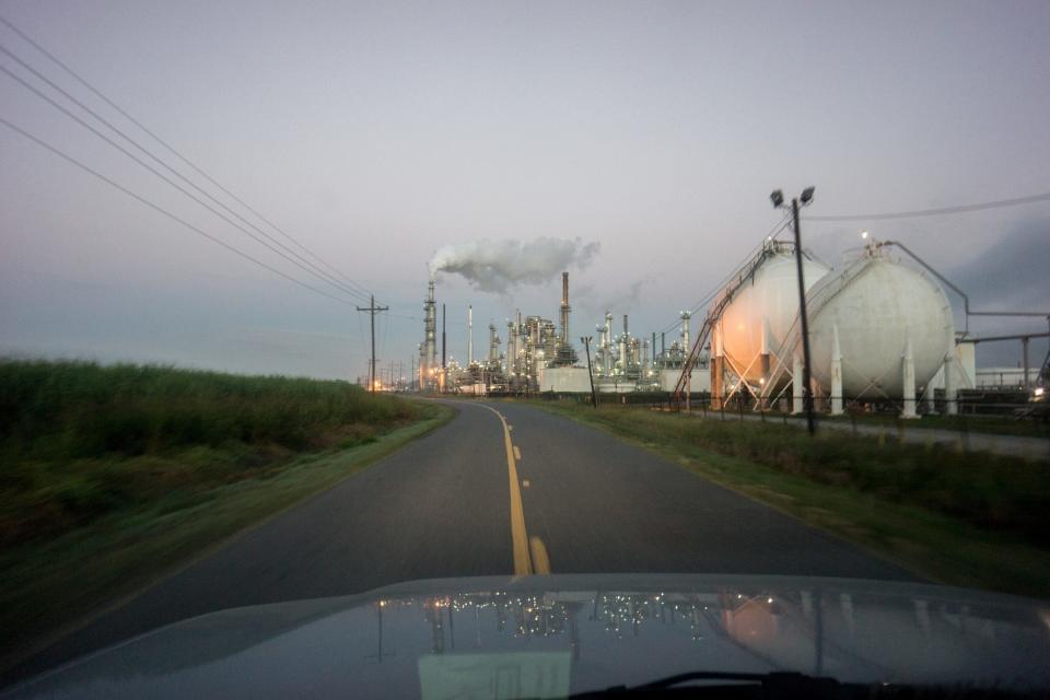 Smoke billows from one of many chemical plants in the area October 12, 2013. '