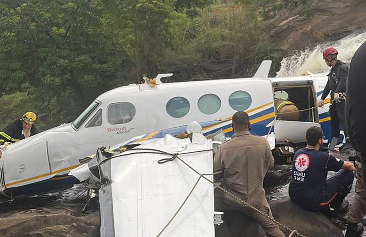 This handout photo released by Minas Gerais Civil Police shows the crashed airplane plane that was transporting Brazilian singer Marilia Mendonca, in the southeastern state of Minas Gerais Brazil, Friday, Nov. 5, 2021. 