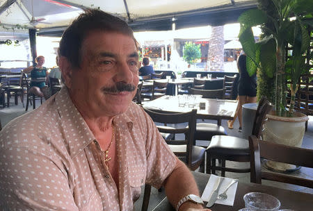 Restaurant owner Armando Cozzolino sits in his restaurant called 'La Roma' located in Broadbeach on the Gold Coast in Australia, April 7, 2018. REUTERS/Ian Ransom