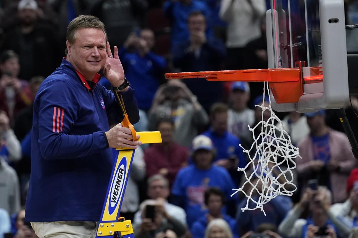 Kansas head coach Bill Self cuts down the net after a college basketball game in the Elite 8 round of the NCAA tournament against Miami Sunday, March 27, 2022, in Chicago. Kansas won 76-50 to advance to the Final Four. (AP Photo/Charles Rex Arbogast)