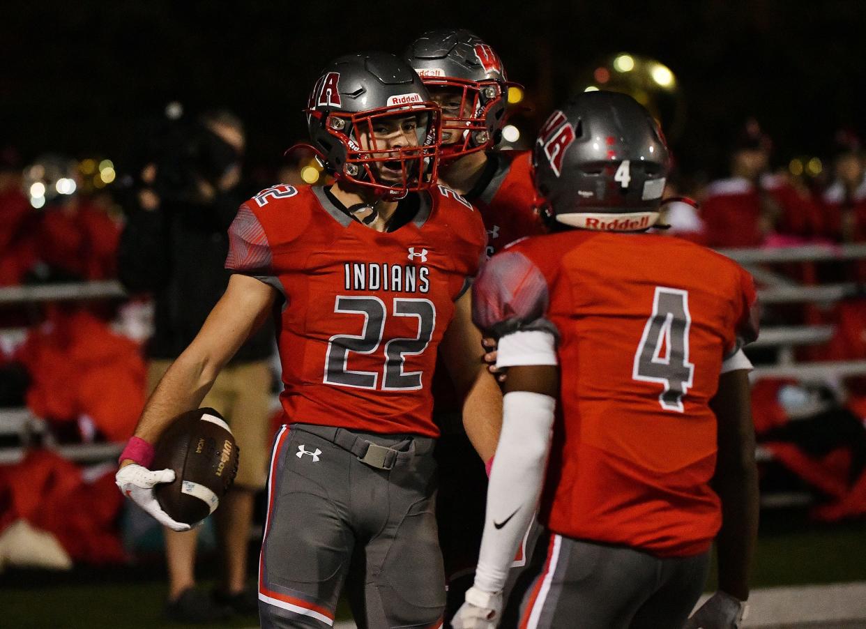 West Allegheny’s Roman Police celebrates a touchdown with his teammates during Friday night’s game at West Allegheny High School.