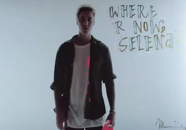 Looks like the drama between Justin Bieber and Selena Gomez is far from being over. Justin dropped the music video for his latest single, Skrillex and Diplo's "Where Are U Now," on Monday, in which fans see a much more vulnerable side of the 21-year-old singer. In the video, people are asked to come into a gallery and graffiti over photos of his face. At one point during the trippy video, the writing spells out, "Where r now, Selena." Vevo <strong>PHOTOS: Hollywood's Most On-Again/Off-Again Couples</strong> "Justin wrote this record during a tough time in his life and it comes to us that sometimes, as artists, we are also just objects and we have to take that as much as we have to use that to create," Skrillex and Diplo wrote in a statement accompanying the video on YouTube. "We all do this for you, respect that you put us here and it's Ü that made the video." Aside from looking pretty somber, Justin also shows off some dance moves in the video. Fast-forward to the 1:37 mark to see Justin's signature swagger. With lyrics like, "Now I'm all alone and my joys turned to moping/Tell me, where are you now that I need you?/ Couldn't find you anywhere/When you broke down I didn't leave ya/I was by your side/where are you now that I need ya?" it isn't hard to imagine the song is about his on-again, off-again relationship with Selena. <strong>WATCH: Justin Bieber -- Selena Gomez Inspired A Lot of Music On My New Album</strong> But is Selena moving on with ... Ed Sheeran?! The two had dinner at the Sunset Towers Hotel last Thursday before hitting up "Nobody Love" singer Tori Kelly's release party together, which they reportedly left five minutes after Justin showed up. Watch below: