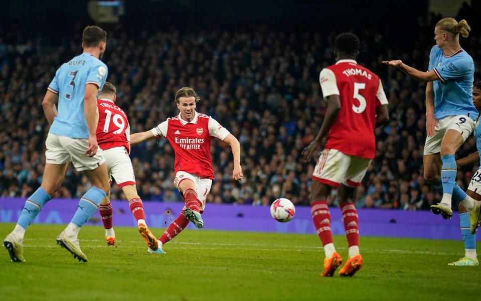 Arsenal's Rob Holding, center, scores his side's first goal during the English Premier League - AP Photo/Dave Thompson