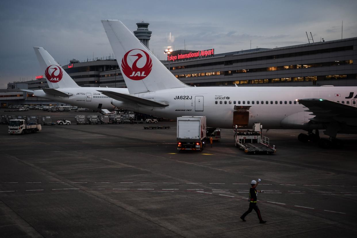 Japan Airlines aircraft are seen on the tarmac at the Tokyo Haneda International Airport on July 11, 2020. (Photo by CHARLY TRIBALLEAU / AFP) (Photo by CHARLY TRIBALLEAU/AFP via Getty Images)