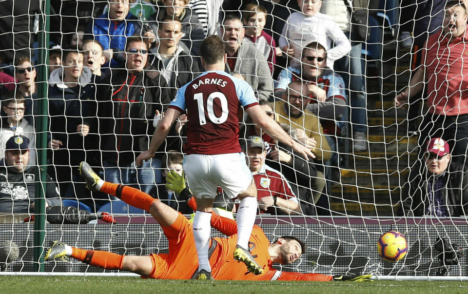 Burnley's Ashley Barnes scores his side's second goal of the game against Tottenham Hotspur during their English Premier League soccer match at Turf Moor in Burnley, England, Saturday Feb. 23, 2019. (Martin Rickett/PA via AP)