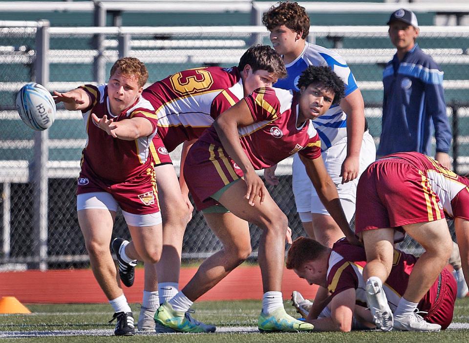 Weymouth's Josh Cullivan pitches the ball to another player after a scrum in a rugby match against Braintree on Friday, May 3, 2024.