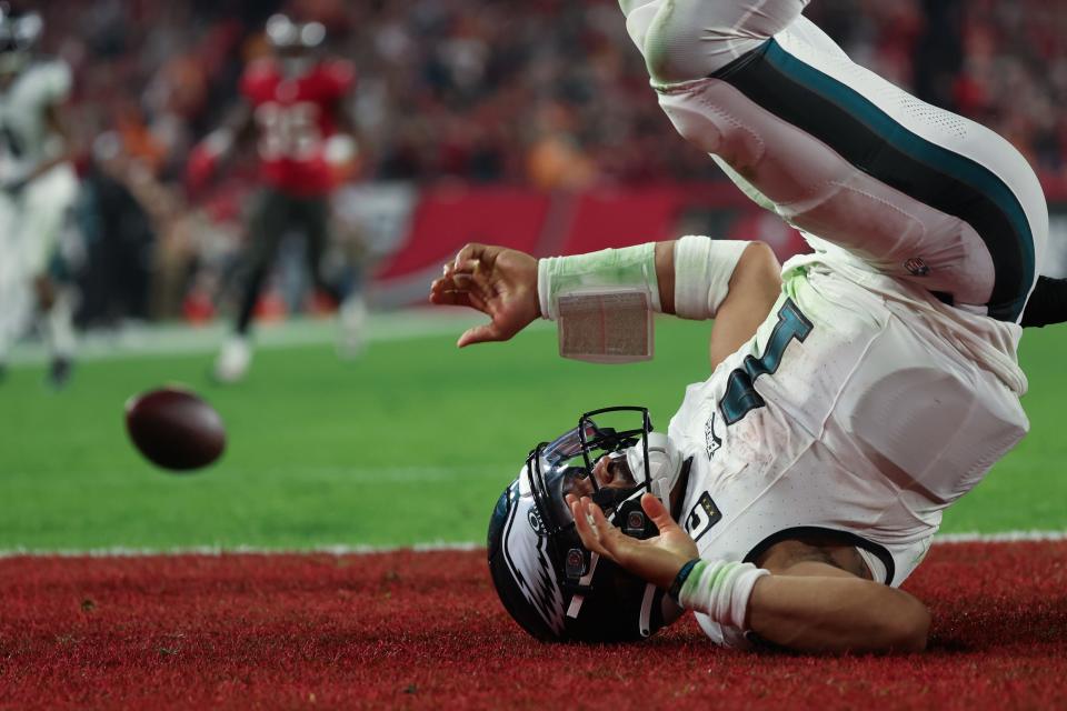 Philadelphia Eagles quarterback Jalen Hurts is tackled for a safety against the Tampa Bay Buccaneers during the second half of a 2024 NFC wild card game at Raymond James Stadium.