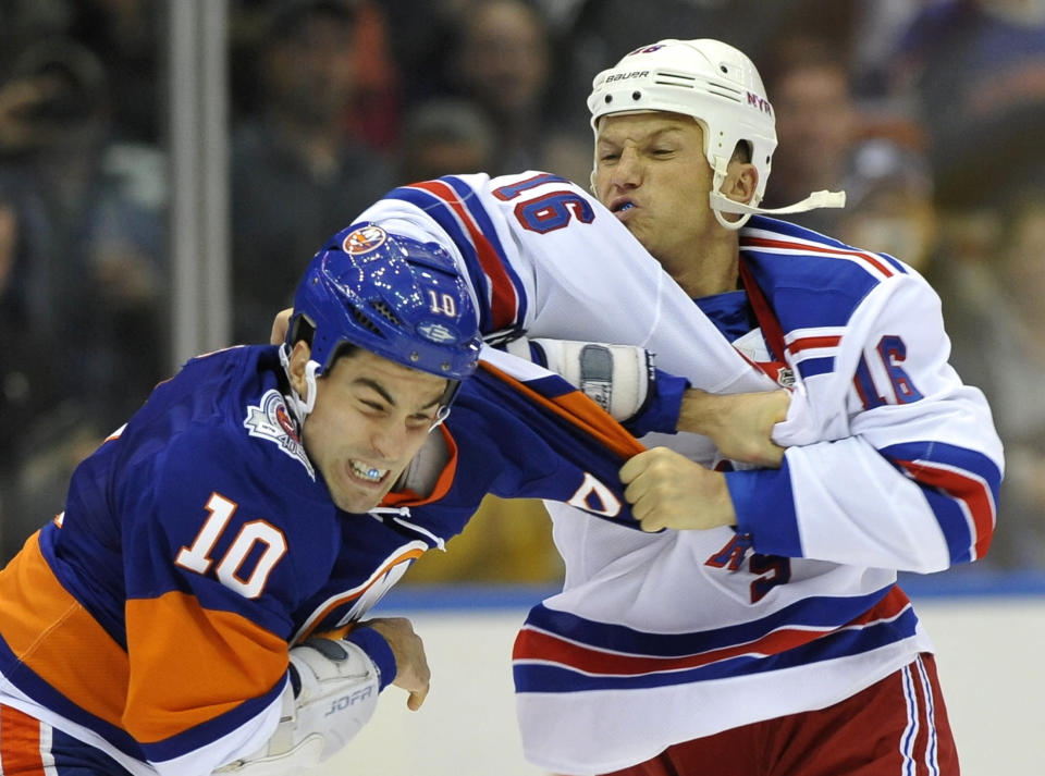 New York Rangers' Sean Avery (16) fights with New York Islanders' Mike Mottau (10) during the second period of an NHL hockey game on Tuesday, Nov. 15, 2011, in Uniondale, N.Y. (AP Photo/Kathy Kmonicek)