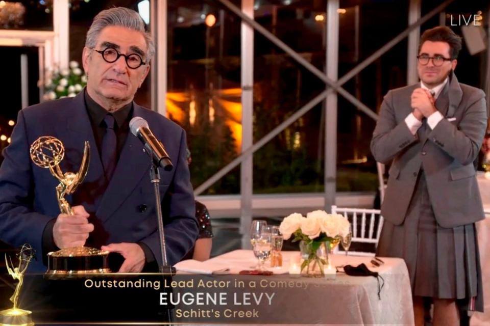 Eugene Levy receives his Emmy Award for Outstanding Lead Character in a Comedy (AFP)