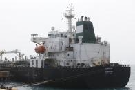 Iranian oil tanker Fortune is anchored at the dock of the El Palito refinery near Puerto Cabello, Venezuela, Monday, May 25, 2020. The first of five tankers loaded with gasoline sent from Iran is expected to temporarily ease Venezuela's fuel crunch while defying Trump administration sanctions targeting the two U.S. foes. (AP Photo/Ernesto Vargas)