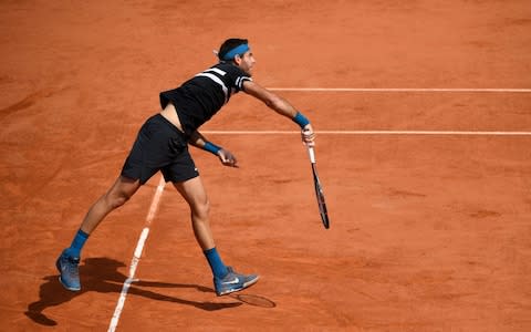 Argentina's Juan Martin del Potro serves to Spain's Rafael Nadal during their men's singles semi-final match on day thirteen of The Roland Garros 2018 French Open tennis tournament in Paris on June 8, 2018 - Credit: AFP