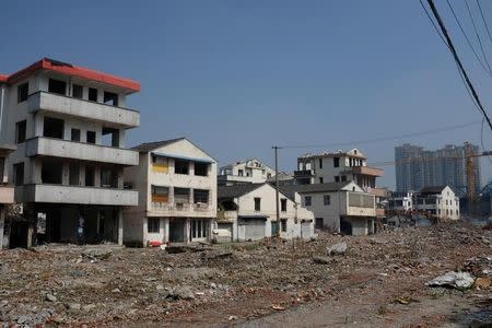 Half-demolished buildings and debris are seen in Wenzhou, Zhejiang Province, China, May 12, 2016. REUTERS/Brenda Goh