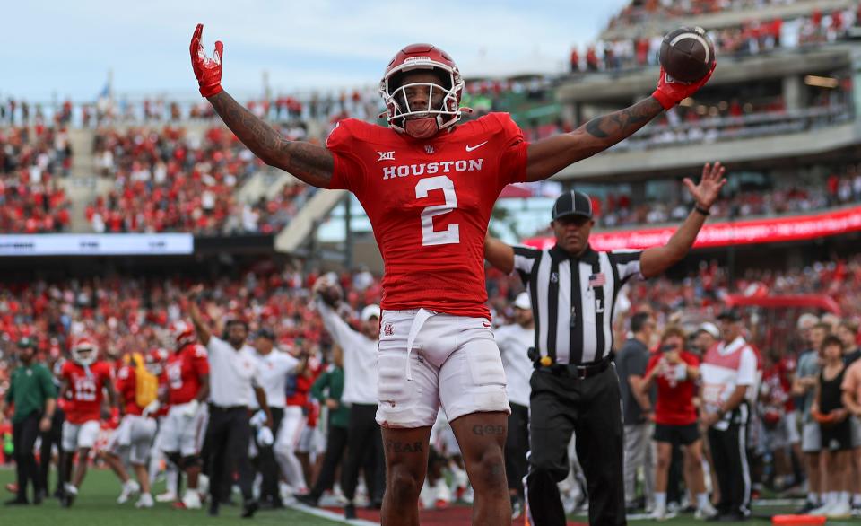 Oct 21, 2023; Houston, Texas, USA; Houston Cougars wide receiver Matthew Golden (2) celebrates after scoring a touchdown during the third quarter against the Texas Longhorns at TDECU Stadium.