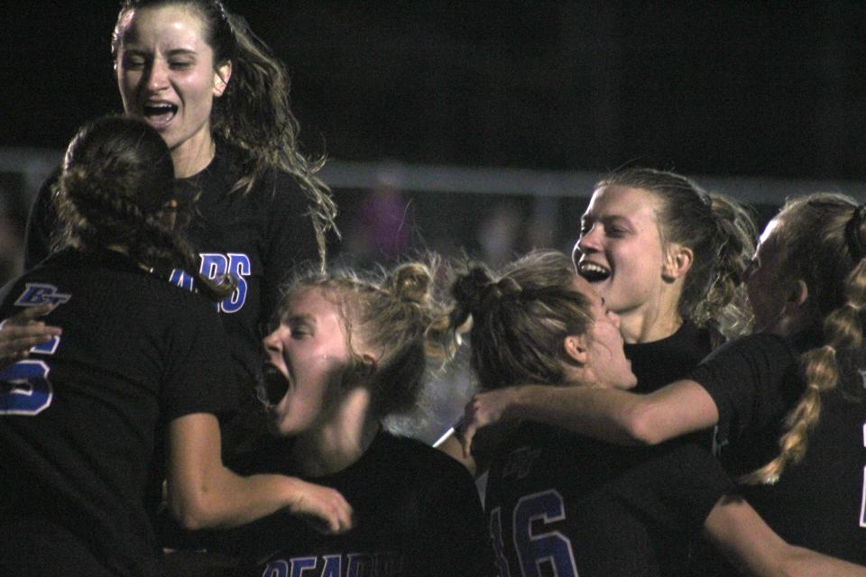 Bartram Trail players celebrate with forward Olivia Bori (6, bottom left) after her goal to open the second half against Creekside in the FHSAA Region 1-7A high school girls soccer final on February 14, 2023. [Clayton Freeman/Florida Times-Union]