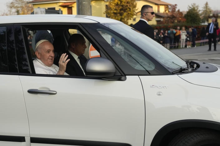 Pope Francis greets faithful upon his arrival in San Carlo, near Asti, Italy, Saturday, Nov. 19, 2022. The Pontiff returned to his father's birthplace in northern Italy on Saturday for the first time since ascending the papacy to celebrate the 90th birthday of a second cousin who long knew him as simply "Giorgio." (AP Photo/Gregorio Borgia)