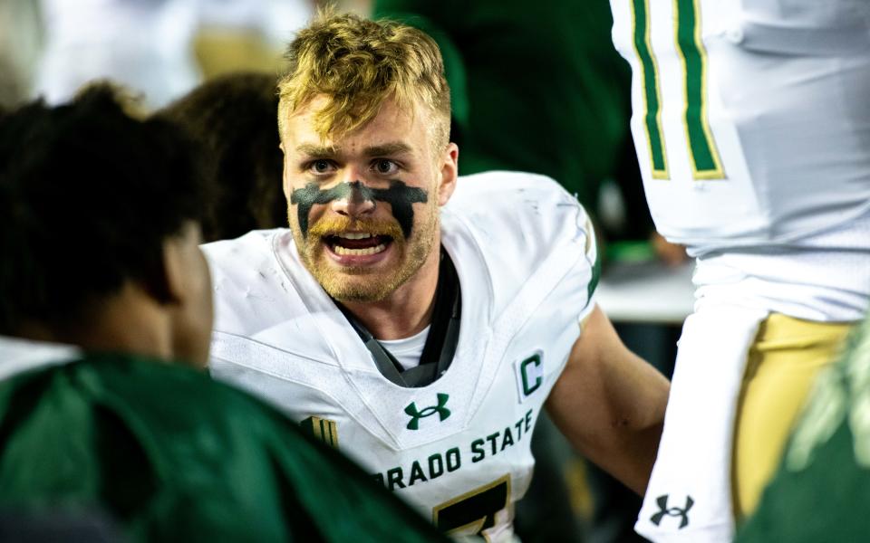 CSU football's junior safety Jack Howell fires up his teammates on the bench against Wyoming at War Memorial Stadium on Friday Nov. 3, 2023, in Laramie, Wyoming.
