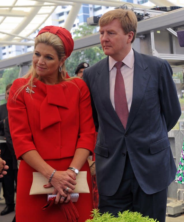 Prince Willem Alexander (R) and Princess Maxima (L) of the Netherlands are pictured in Singapore on January 25, 2013. The prince will become the first Dutch king since Willem III, who reigned until his death in 1890