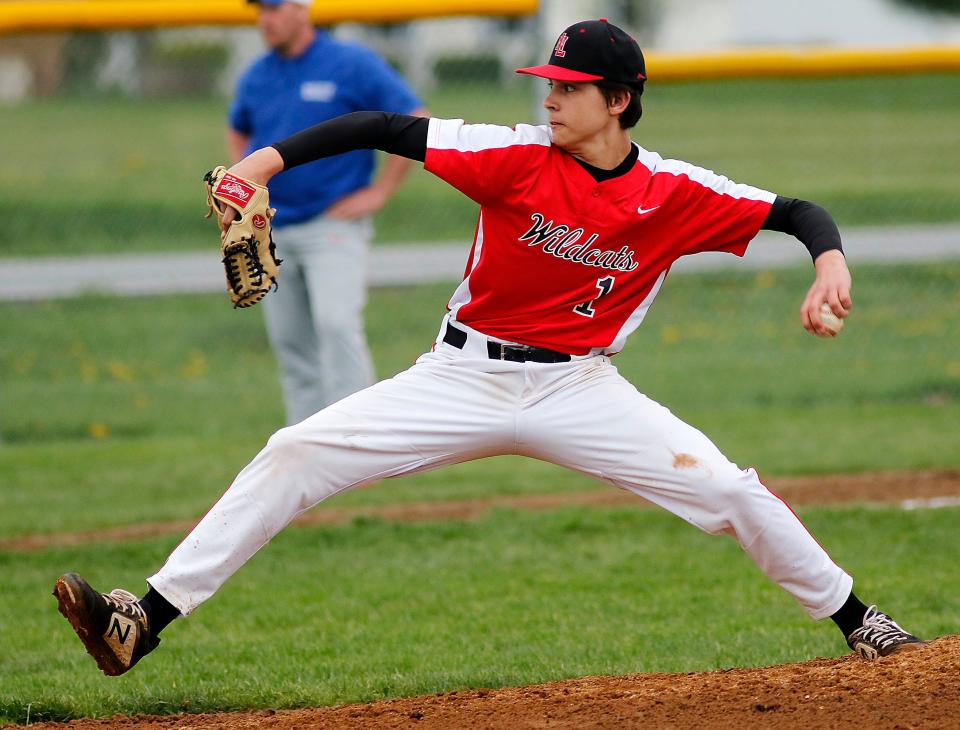 New London High School's Steven Justavick (1) delivers a pitch against Mapleton High School during high school baseball action Monday, April 25, 2022 at Mapleton High School. TOM E. PUSKAR/TIMES-GAZETTE.COM