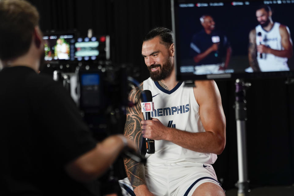 Memphis Grizzlies' Steven Adams, right, responds to questions during the NBA basketball team's media day in Memphis, Tenn. Monday, Oct. 2, 2023. (AP Photo/George Walker IV)