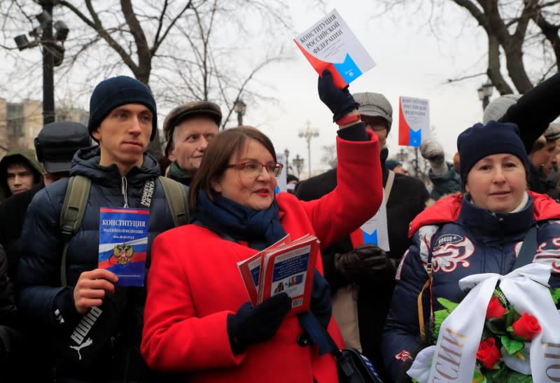 Yulia Galyamina, a Moscow city councillor, holds a copy of Russia's constitution during a rally against constitutional reforms proposed by President Vladimir Putin, in Moscow