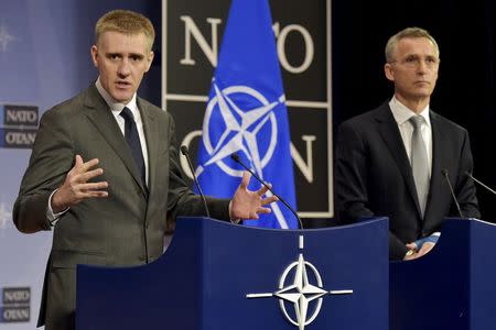 NATO Secretary General Jens Stoltenberg (R) holds a news conference with Foreign Minister of Montenegro Igor Luksic after a NATO foreign ministers meeting at the Alliance's headquarters in Brussels, Belgium, December 2, 2015. REUTERS/Eric Vidal