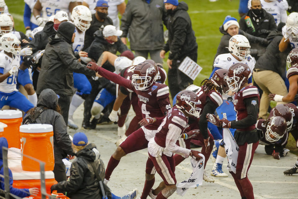 FORT WORTH, TX - DECEMBER 31: A fight breaks out after the game cancelling the trophy presentation after the Armed Forces Bowl game between the Tulsa Golden Hurricane and the Mississippi State Bulldogs on December 31, 2020 at Amon G. Carter Stadium in Fort Worth, Texas. (Photo by Matthew Pearce/Icon Sportswire via Getty Images)