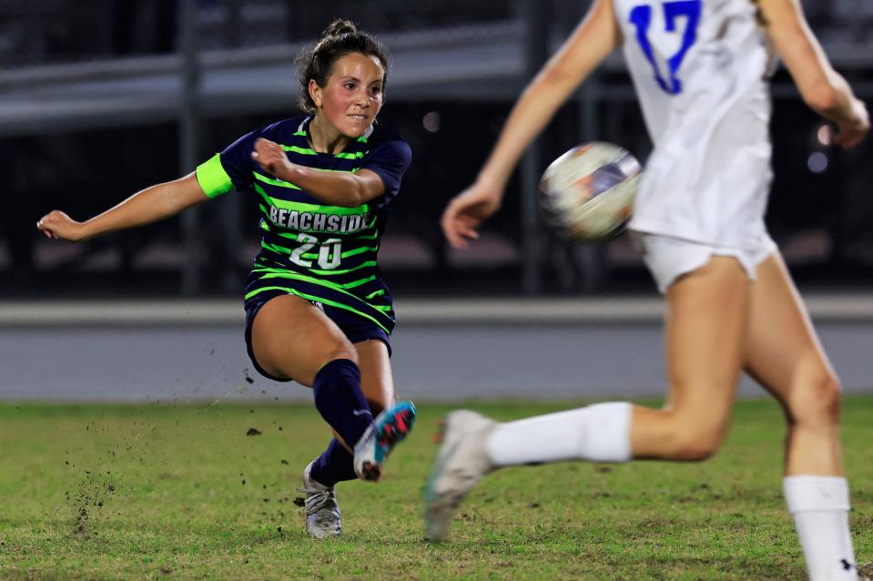 Beachside's Ayla Kiziltas (20) kicks the ball against Clay during a Class 5A playoff.