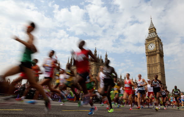 Athletes pass the Palace of Westminster as they compete in the Men's Marathon on Day 16 of the London 2012 Olympic Games on the streets of London on August 12, 2012 in London, England. (Photo by Ezra Shaw/Getty Images)