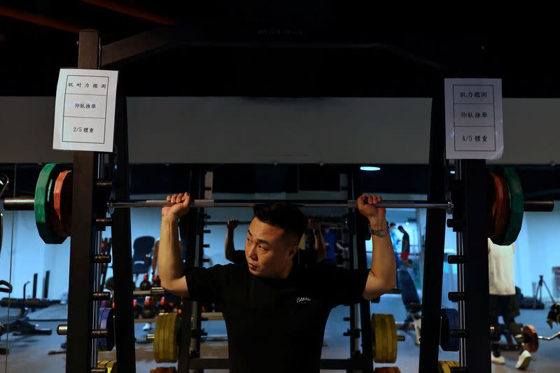 Chiang Chung-hao, 34, the lead singer of Taiwan's Air Force "Tiger Band" exercieses at the gym at Chihhang Air Base in Taitung