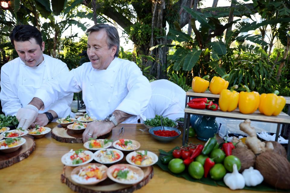 Daniel Boulud feeds the guests.