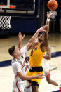 Grambling guard Cameron Woodall is fouled by Arizona forward Azuolas Tubelis (10) during the first half of an NCAA college basketball game Friday, Nov. 27, 2020, in Tucson, Ariz. (AP Photo/Rick Scuteri)