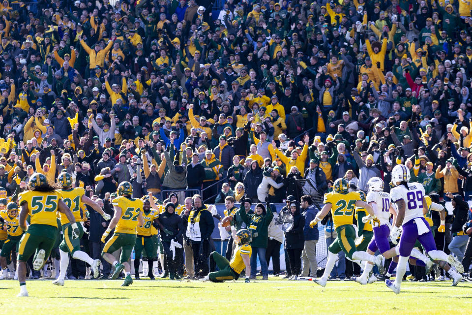 FILE - In this Jan. 11, 2020, file photo, North Dakota State safety James Hendricks (6) slides on the field after intercepting a pass from James Madison quarterback Ben DiNucci during the the second half of the FCS championship NCAA college football game in Frisco, Texas. As the college football season ramps up in three major conferences and among other programs scattered across the country, there will be a void at the Football Championship Subdivision level -- very few games and no scheduled playoffs. (AP Photo/Sam Hodde, File)