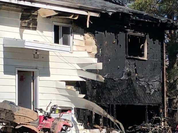 About 30 firefighters were sent an apartment building on fire in Lincoln, southeast of Fredericton. (Ed Hunter/CBC - image credit)