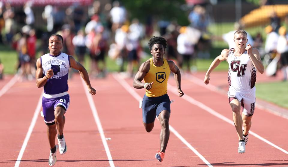 Moeller's Brandon White (center) competes against Pickerington Central's Troy Lane and Canal Winchester's  Dylan Randall at the OHSAA state track meet at Jesse Owens Memorial Stadium, Friday, June 3, 2022.