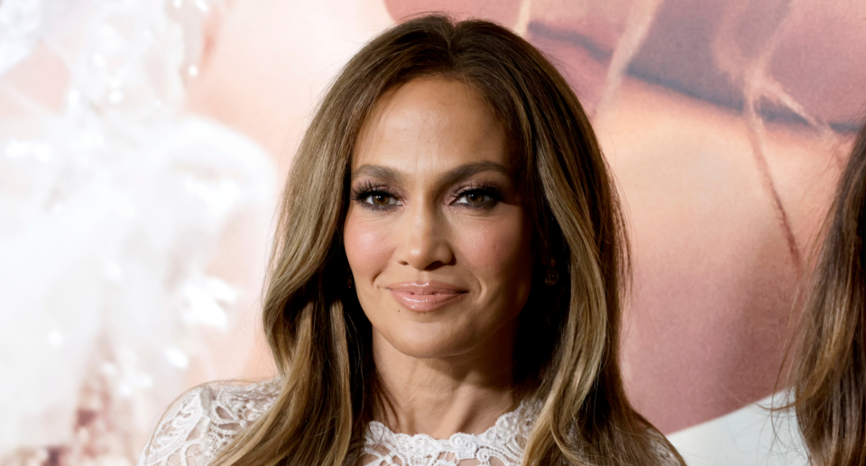 jennifer lopez in white dress with long brown hair at 