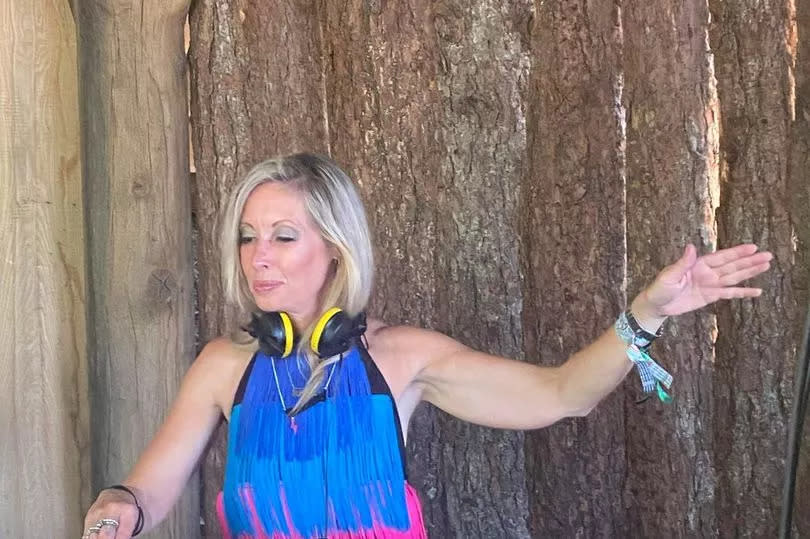 Sammy Dean, 50, DJing at Glastonbury Spike Bar -Credit:Sammy Dean / SWNS