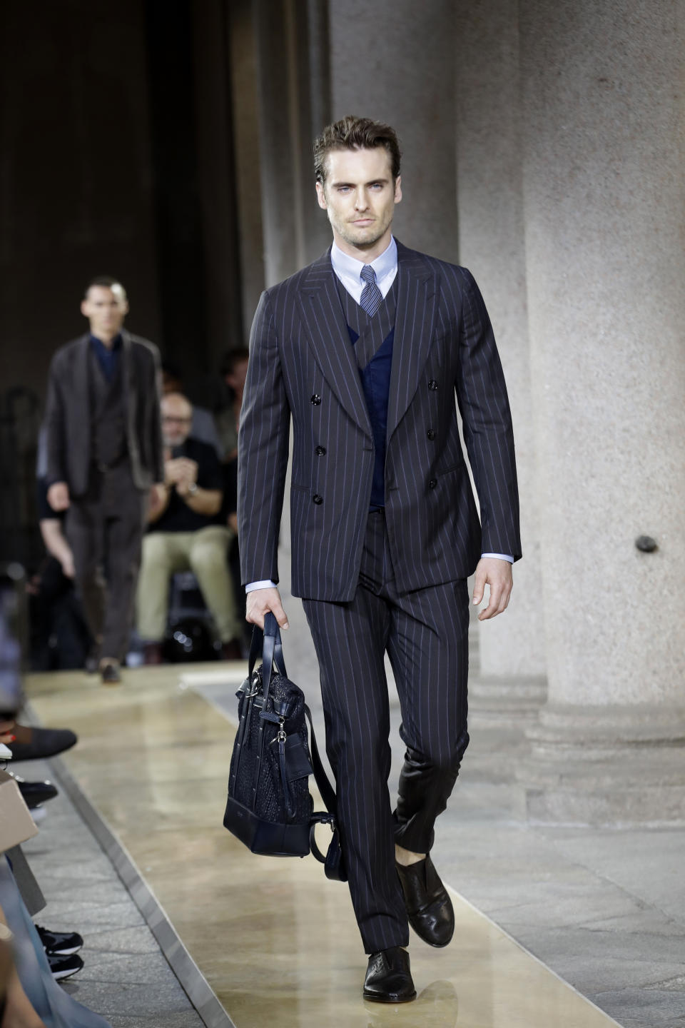 A model wears a creation as part of the Armani men's Spring-Summer 2020 collection, unveiled during the fashion week, in Milan, Italy, Monday, June 17, 2019. (AP Photo/Luca Bruno)