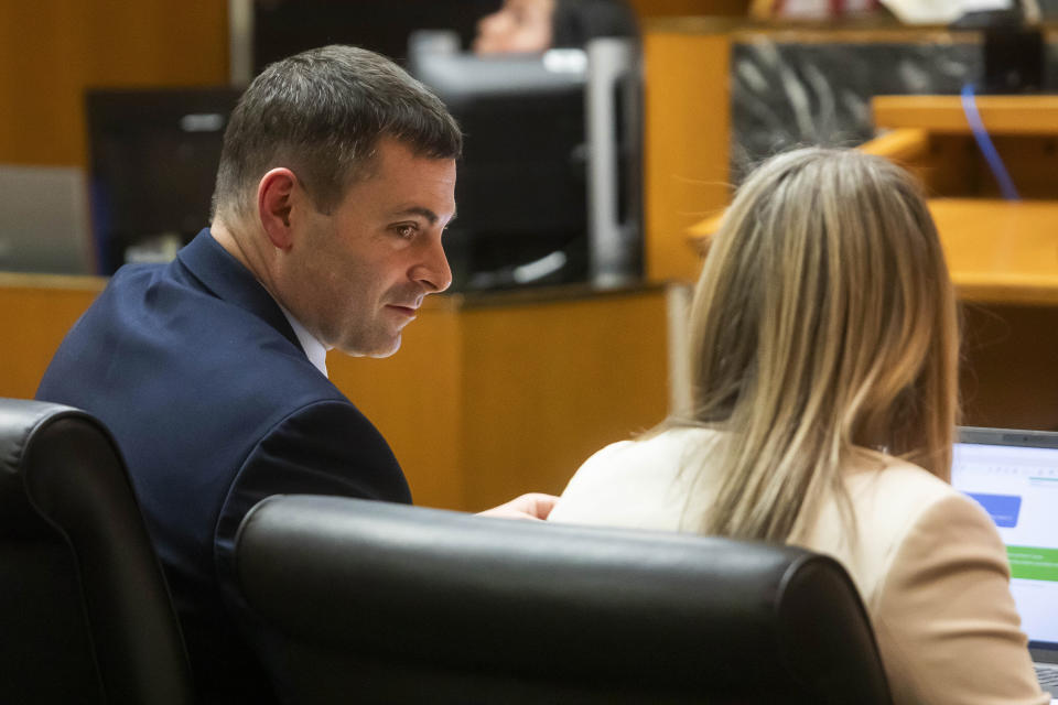 Assistant Oakland County Prosecutor Marc Keast, left, speaks with Oakland County Prosecutor Karen McDonald, right, during a jury trial for Jennifer Crumbley at the Oakland County Courthouse on Wednesday, Jan. 31, 2024, in Pontiac, Mich. Jennifer Crumbley is charged with involuntary manslaughter for gross negligence in connection with her son Ethan Crumbley who shot and killed four classmates at Oxford High School in November 2021. James Crumbley, Ethan's father, is also charged with involuntary manslaughter but will be tried separately. (Katy Kildee/Detroit News via AP, Pool)