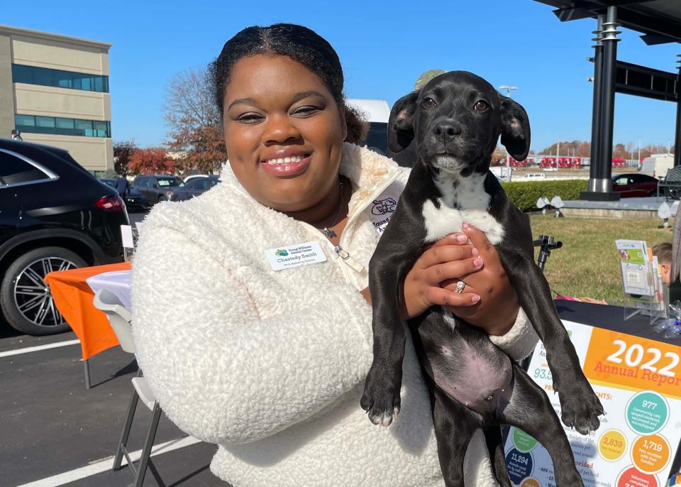 Young-Williams Animal Center Marketing Manager Chastedy Smith with Mike the puppy at the inaugural Stuff the Sprinter for Homeless Pets event held at Mercedes-Benz of Knoxville on 10131 Parkside Drive on Nov. 11, 2023.