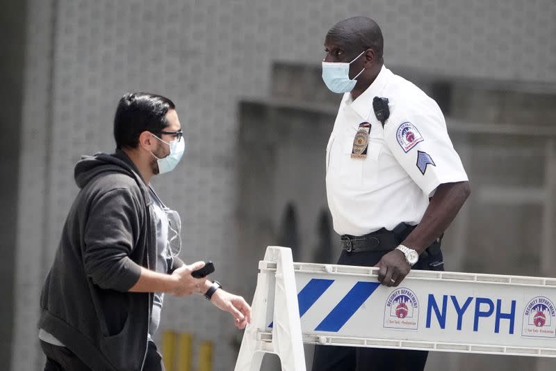 A guard prevents access to a street outside the New York Presbyterian Hospital where U.S. President Donald Trump's brother Robert has been admitted