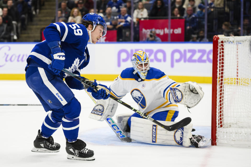 Toronto Maple Leafs left wing Tyler Bertuzzi (59) shoots wide of Buffalo Sabres goaltender Devon Levi (27) during the second period of an NHL hockey game Saturday, Nov. 4, 2023, in Toronto. (Christopher Katsarov/The Canadian Press via AP)