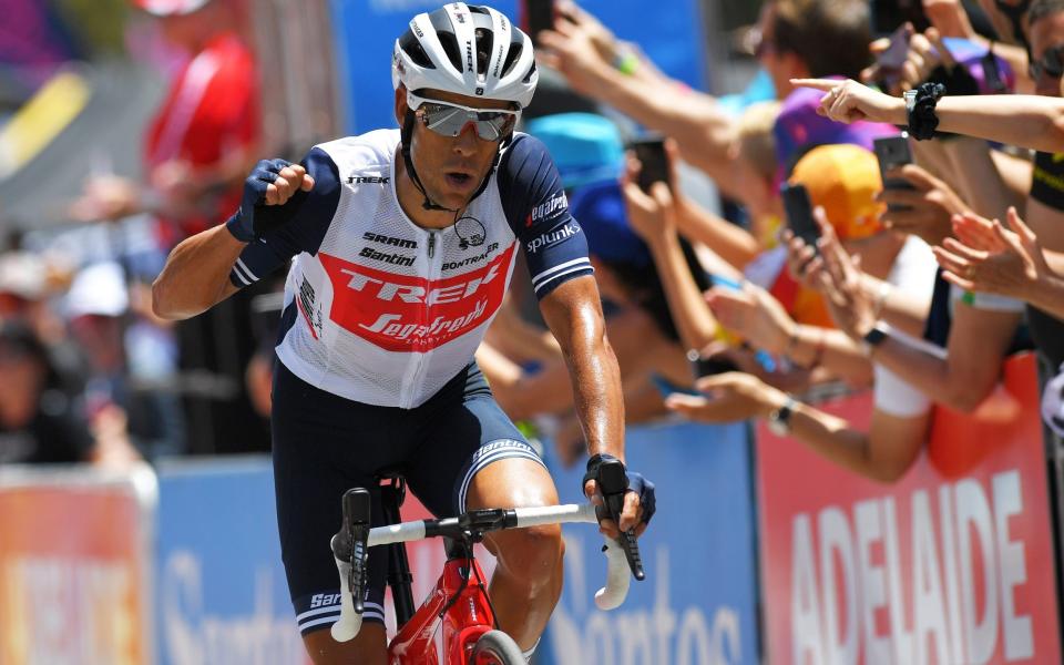 Richie Porte celebrates winning the Tour Down Under title after crossing the finish line - Velo