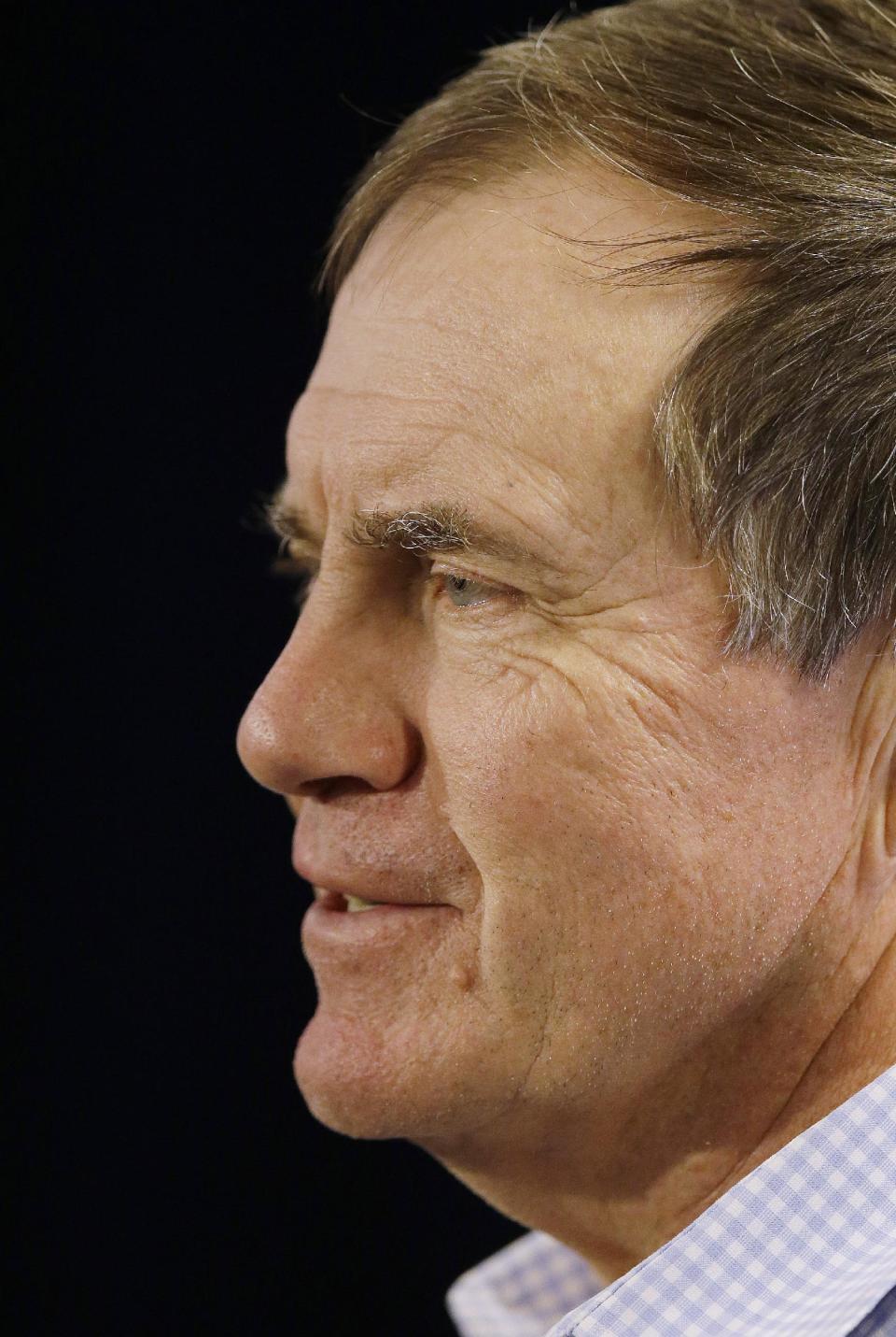 New England Patriots head coach Bill Belichick smiles as he respond's to a reporter's question during a media availability at the NFL football team's facility in Foxborough, Mass., Monday, Jan. 20, 2014. The Patriots lost to the Denver Broncos in the AFC Championship game Sunday in Denver ending their season. (AP Photo/Stephan Savoia)