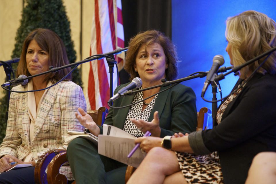 FILE - Democratic challenger for Rhode Island governor, Secretary of State Nellie Gorbea, center, speaks during a gubernatorial election forum hosted by the Greater Providence Chamber of Commerce in Warwick, R.I., Sept. 8, 2022. Rhode Island will hold its primary on Tuesday, Sept. 13. (AP Photo/David Goldman, File)