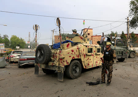 Afghan security forces keep watch at the site of blasts in Jalalabad city, Afghanistan May 13, 2018. REUTERS/Parwiz