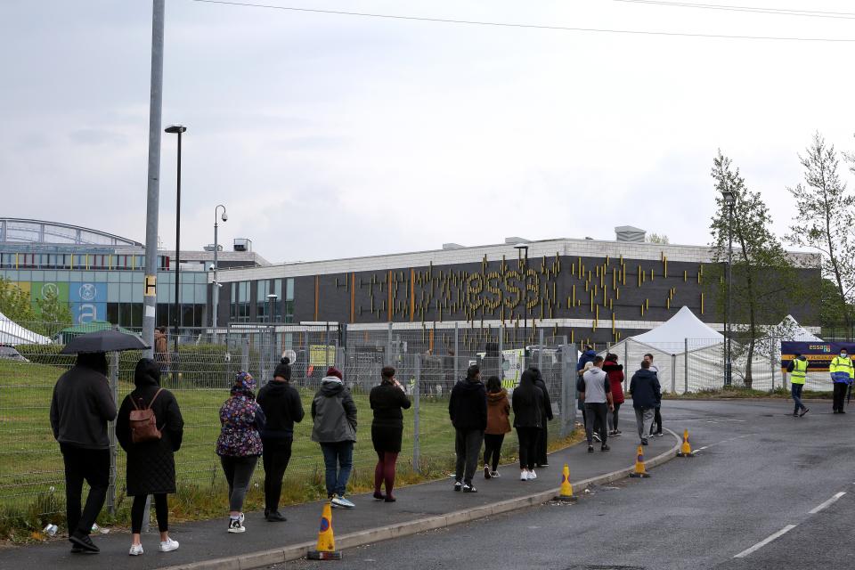 <p>Long vaccine queues were seen in Bolton on Saturday</p> (Getty Images)